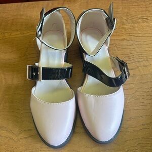 Pink shoes with black straps